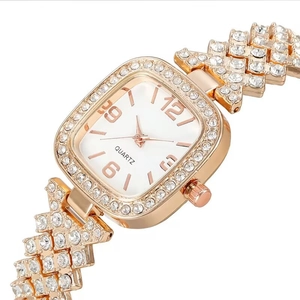 Montre luxueuse en or rose pour femme avec cristaux brillants et cadran blanc carré