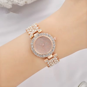 Luxurious rose gold women's watch with shimmering crystals on dial and metal band