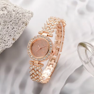 Macro side view of rose gold women's watch with full crystal pavé on dial and band