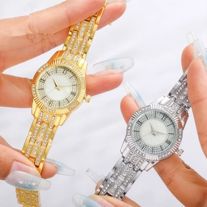 Luxurious gold and silver steel watches with full rhinestone pavé and Roman numerals