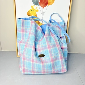 Plaid canvas tote bag featuring large capacity and blue-pink checkered patterns for daily use