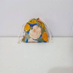 Detail of floral drawstring pouch with unique 3D relief texture and cotton ropes