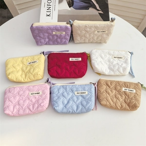 Colorful quilted heart mini cosmetic pouches with zippers and wrist straps in eight shades