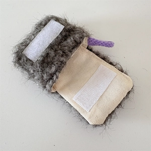 Detailed shot of plush gray earphone case with soft lining and purple hanging loop