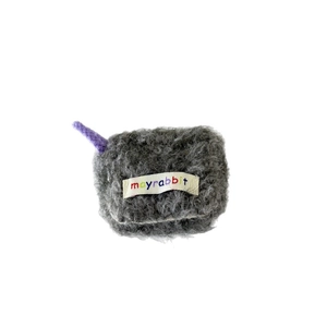 Plush gray faux fur mini earphone case with purple drawstring and colorful logo tag