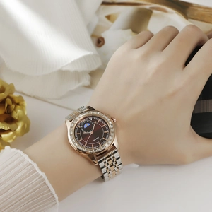 Elegant women's quartz watch with crystal bezel and rose gold steel strap featuring moon phase