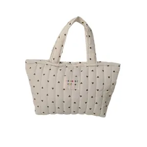 Quilted heart pattern handbag in cream white with soft handle for daily storage