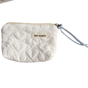 White quilted heart pattern mini storage bag with blue lanyard and zipper closure