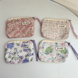 Floral cotton coin purses with wrist strap and zipper in four fresh pastel patterns