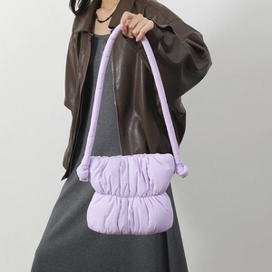 Chic purple pleated puffer bucket bag in nylon, shown as a stylish shoulder bag for women