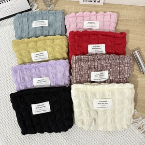 Set of 8 colorful puckered bubble fabric cosmetic bags for travel organization