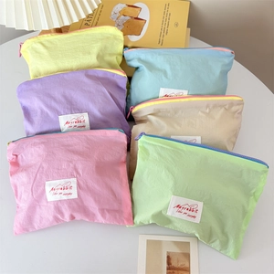 Mini macaron nylon cosmetic pouches in six colors for portable jewelry and coins