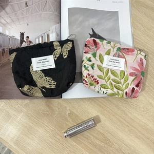 Floral and butterfly embroidery cosmetic bags with ring zippers for travel storage