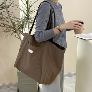Large dark brown canvas tote bag with leopard print lining and front pocket for women