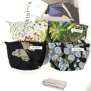 Floral jacquard travel cosmetic bags set with zipper closure and woven label