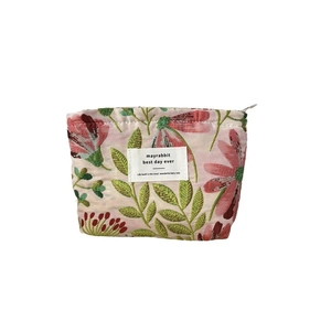 Pink floral embroidered cosmetic bag with zipper closure and jacquard fabric finish