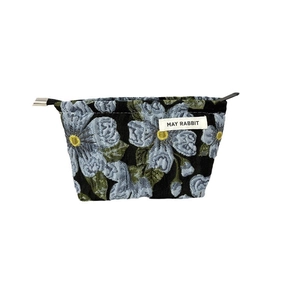 Floral jacquard cosmetic bag with blue flower patterns and drawstring closure