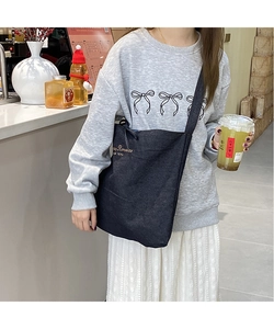 Dark grey denim canvas tote bag with 'Stay Romance' text print in a casual cafe setting