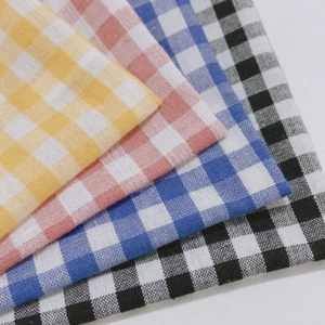 Detail of grid storage bags showing various gingham patterns in cotton fabric textures