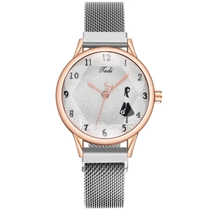 Detail of rose gold watch case with white diamond-textured dial and mesh steel strap