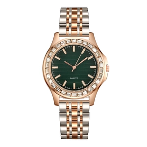 Luxury quartz watch with emerald green dial and crystal-encrusted bezel in two-tone steel