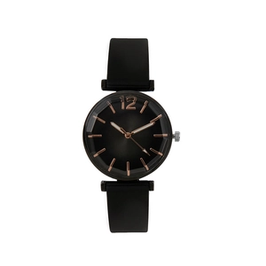 Minimalist all-black quartz watch with silicone strap and geometric faceted glass cover