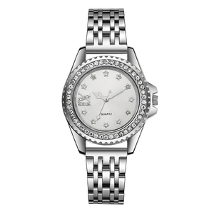 Montre à quartz argentée pour femme avec lunette en strass et index en forme d'étoile