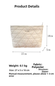Quilted polyester toiletry bag in cream white with bear pattern and zipper detail
