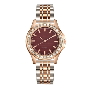 Women's quartz watch with burgundy dial, rhinestone bezel, and two-tone rose gold steel strap