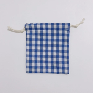 Detail of blue and white checkered cotton storage bag with durable drawstring closure