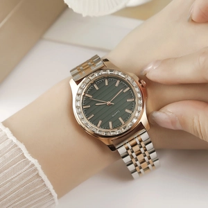 Elegant rose gold and silver watch with green textured dial and crystal-studded bezel