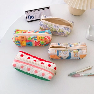 Quilted floral pencil cases in four colorful patterns with a secure zipper closure