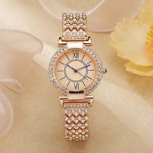 Detail of rose gold watch with sparkling rhinestones and striking blue hands on dial