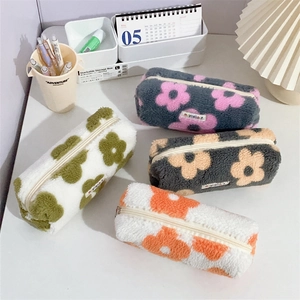 Plush floral pencil cases in four colors with soft faux fur and zip closure