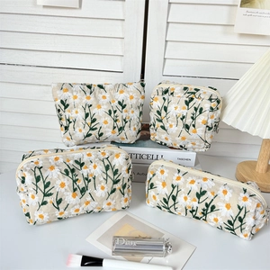 Detailed four-piece set of daisy embroidery canvas makeup bags in various sizes