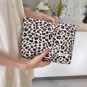 Chic leopard print corduroy cosmetic bag with brand label for travel organization