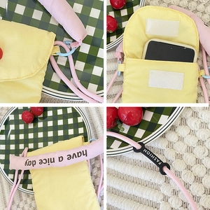 Minimalist yellow fabric phone crossbody bag with pink rope strap and Velcro closure