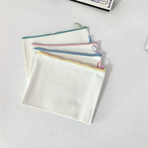 Set of 4 canvas pouches with colorful zippers and metal ring pulls for storage