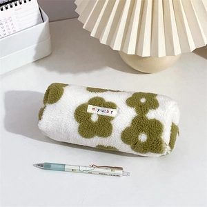Close-up of plush floral pencil case with soft teddy fleece and embroidered rabbit label