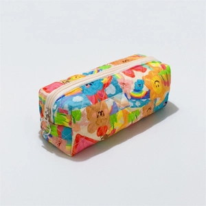 Close-up of quilted floral pencil case showing rainbow patterns and silver zipper pull