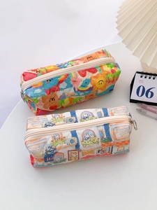 Detail of quilted floral stationery pouches with cute patterns and metal zipper closure