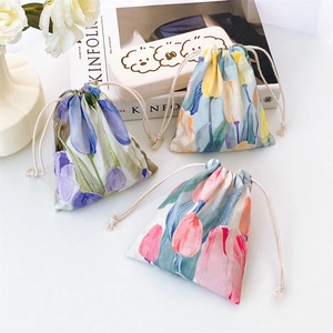 Set of three floral drawstring storage bags in pastel tulip watercolor art patterns