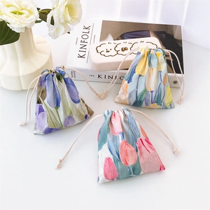 Three-piece floral drawstring pouch set with vintage tulip patterns and soft white cords