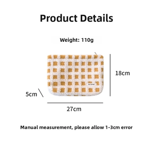 Detail view of yellow waffle weave makeup bag with dimensions 27x18x5cm and zipper close