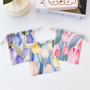 Detailed set of three floral tulip drawstring storage bags in purple yellow and pink cotton