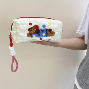 Quilted white heart-pattern storage bag with cute puppy embroidery and red zipper