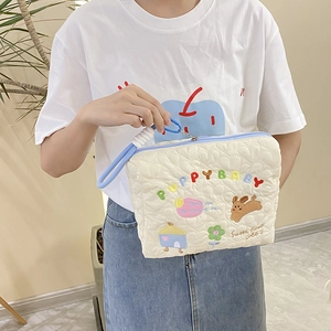 Quilted cotton storage bag with cute puppy embroidery and blue zipper handles