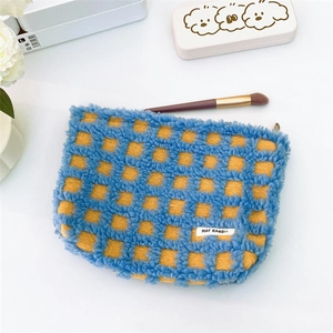 Blue and yellow checkered waffle makeup bag in soft teddy plush with top zipper