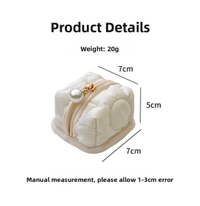 Quilted mini headphone storage bag with dimensions 7x7x5cm and pearl zipper pull