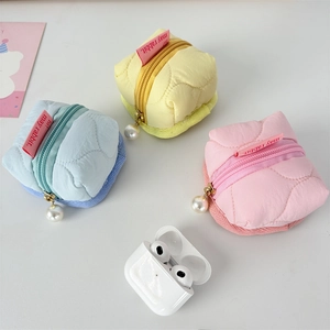 Quilted floral earphone pouches in blue, yellow and pink with pearl zipper pulls